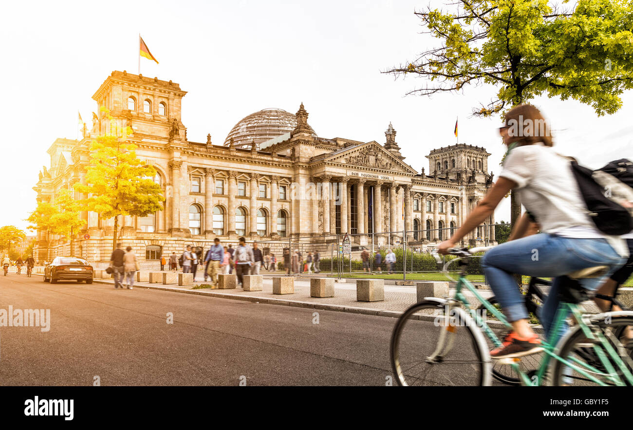 Berlin urban city life with famous Reichstag building at sunset in summer, Berlin Mitte, Germany Stock Photo