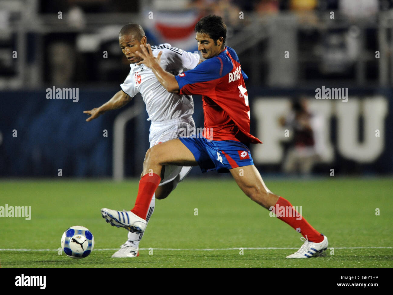 Canada's Simeon Jackson (left) and Costa Rica's Celso Borges battle for the ball. Stock Photo