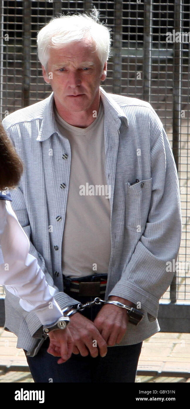 William Mawhinney, 49, is led from Ballymena Magistrates Court after appearing charged with the murder of Lorraine Mills in 1995. Stock Photo