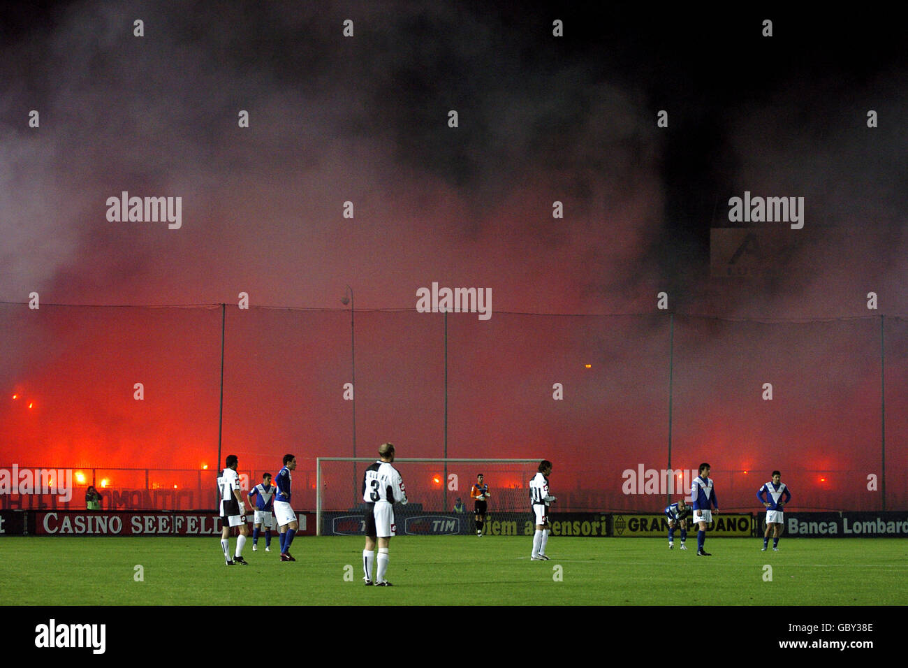 Soccer - Italian Serie A - Brescia v Siena. Siena fans set off flares at the Stadio Comunale Mario Rigamonti Stock Photo