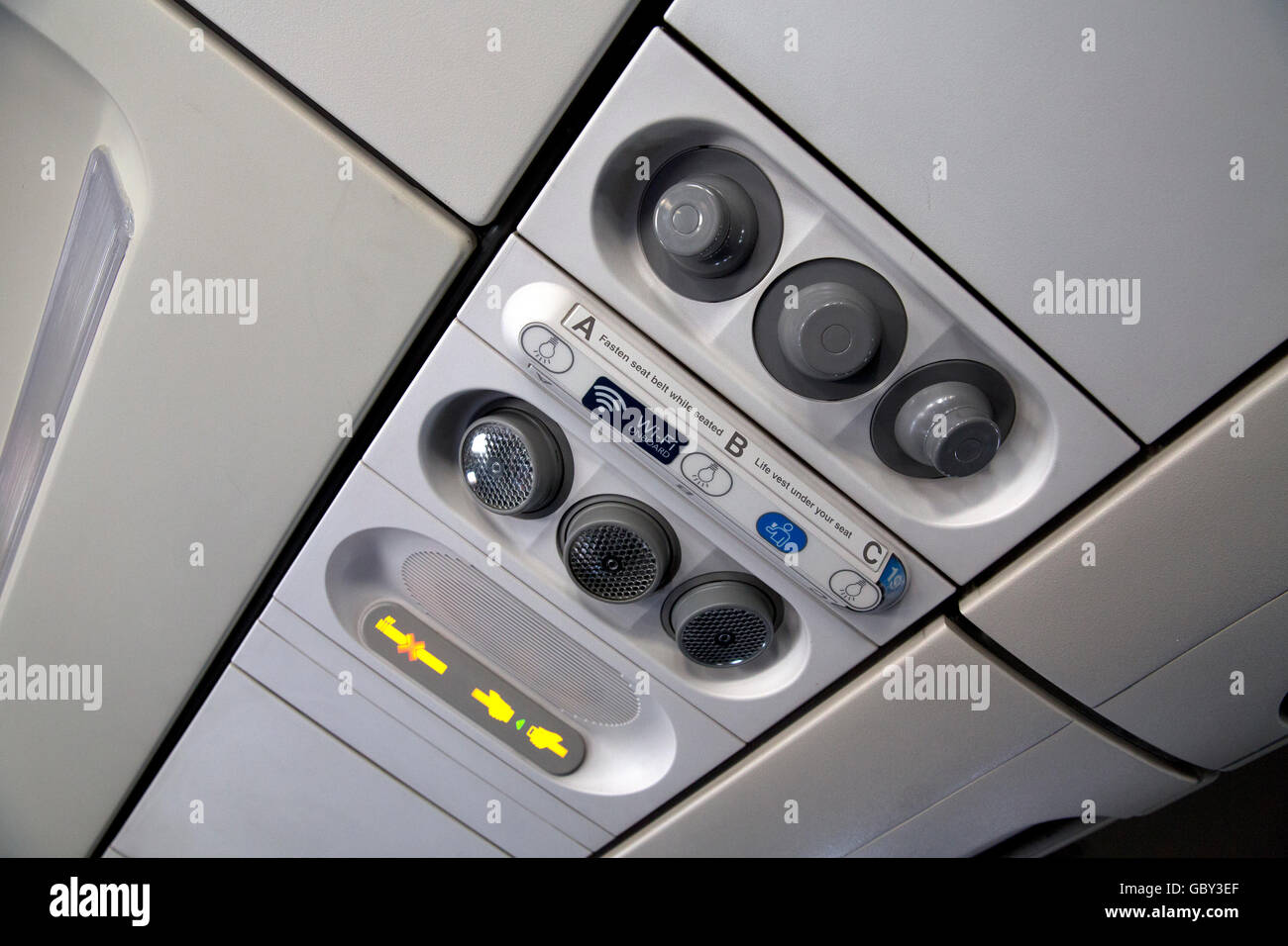 Overhead airline seat controls Stock Photo