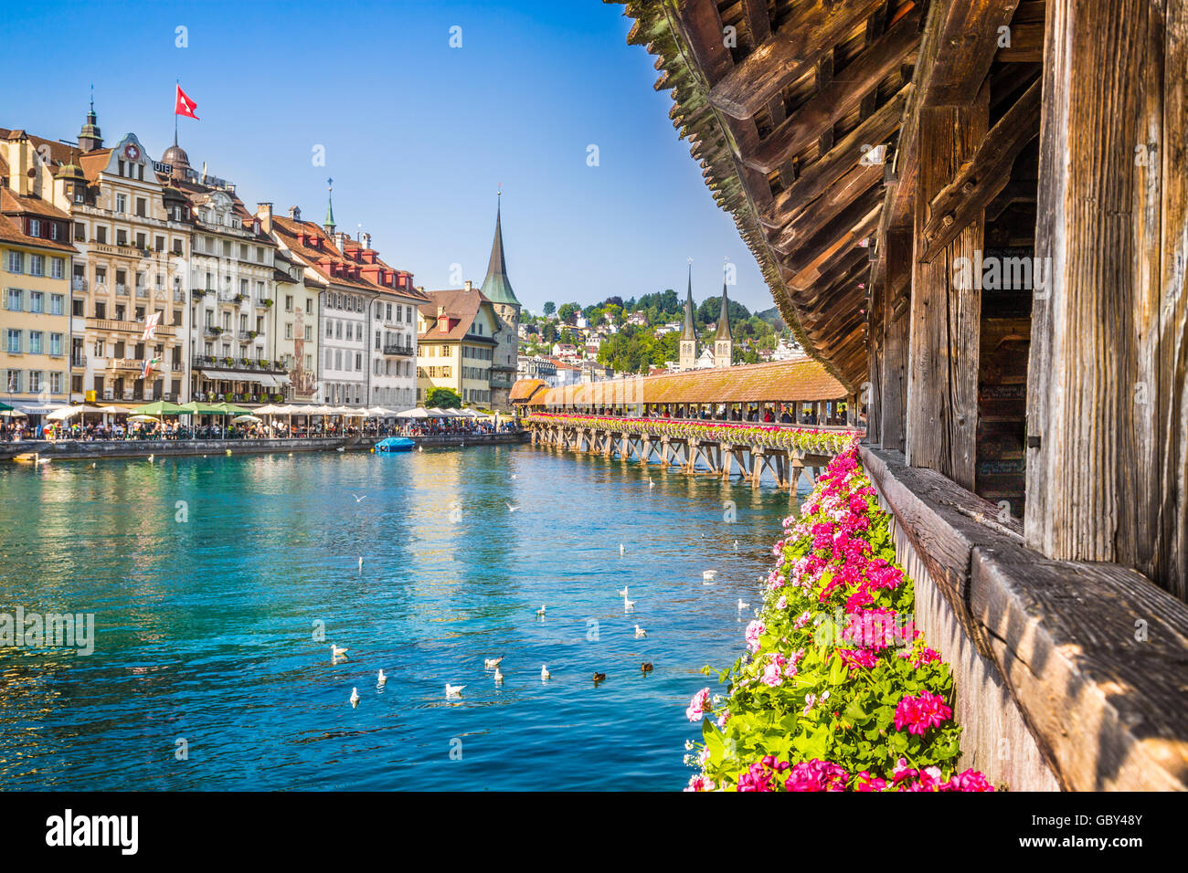 Famous Chapel Bridge in the historic city center of Lucerne, the city's symbol and one of Switzerland's main tourist attractions, Switzerland Stock Photo