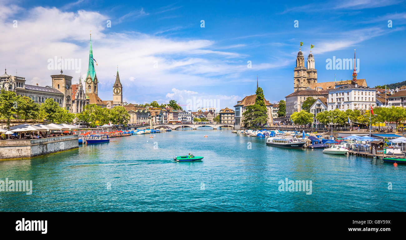 Panoramic view of historic Zurich city center with famous Fraumunster and Grossmunster Churches and river Limmat at Lake Zurich, Switzerland Stock Photo