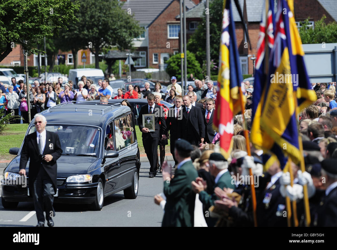Mourners attend the funeral procession for Rifleman James Backhouse in Castleford, West Yorkshire. Backhouse died in an explosion near Sangin in Helmand province on July 10. Stock Photo