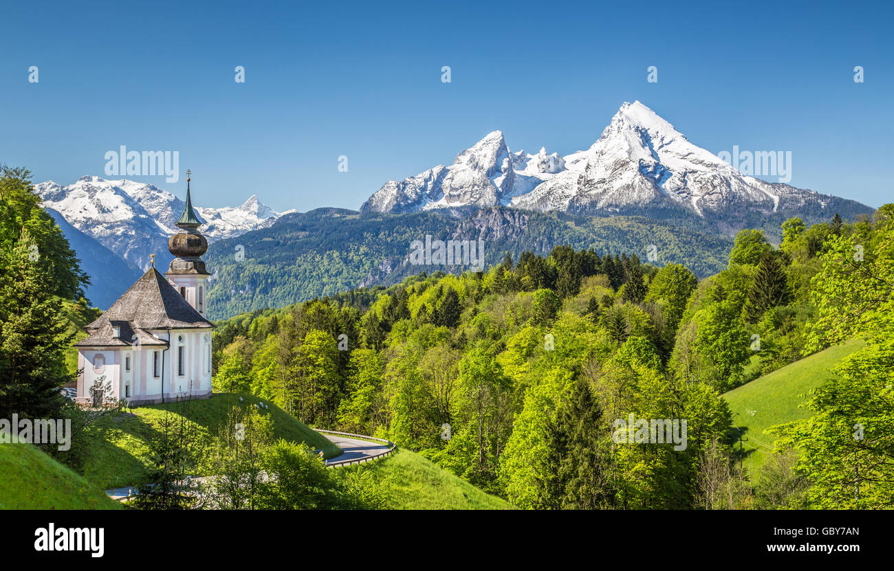 Idyllic mountain scenery in the Alps with pilgrimage church of Maria Gern and Watzmann mountain in springtime, Bavaria, Germany Stock Photo