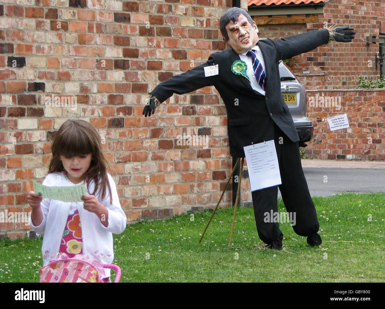 A prize-winning scarecrow of Prime Minister Gordon Brown wears its award after the judges selected it among the dozens of entries in the Muston, near Filey, annual Scarecrow Competition. Stock Photo