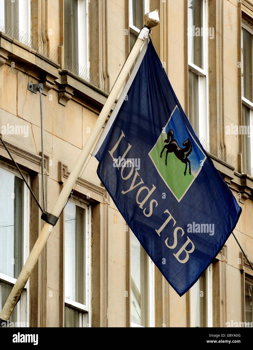 A flag outside the branch of Lloyds at Burton On Trent as the part