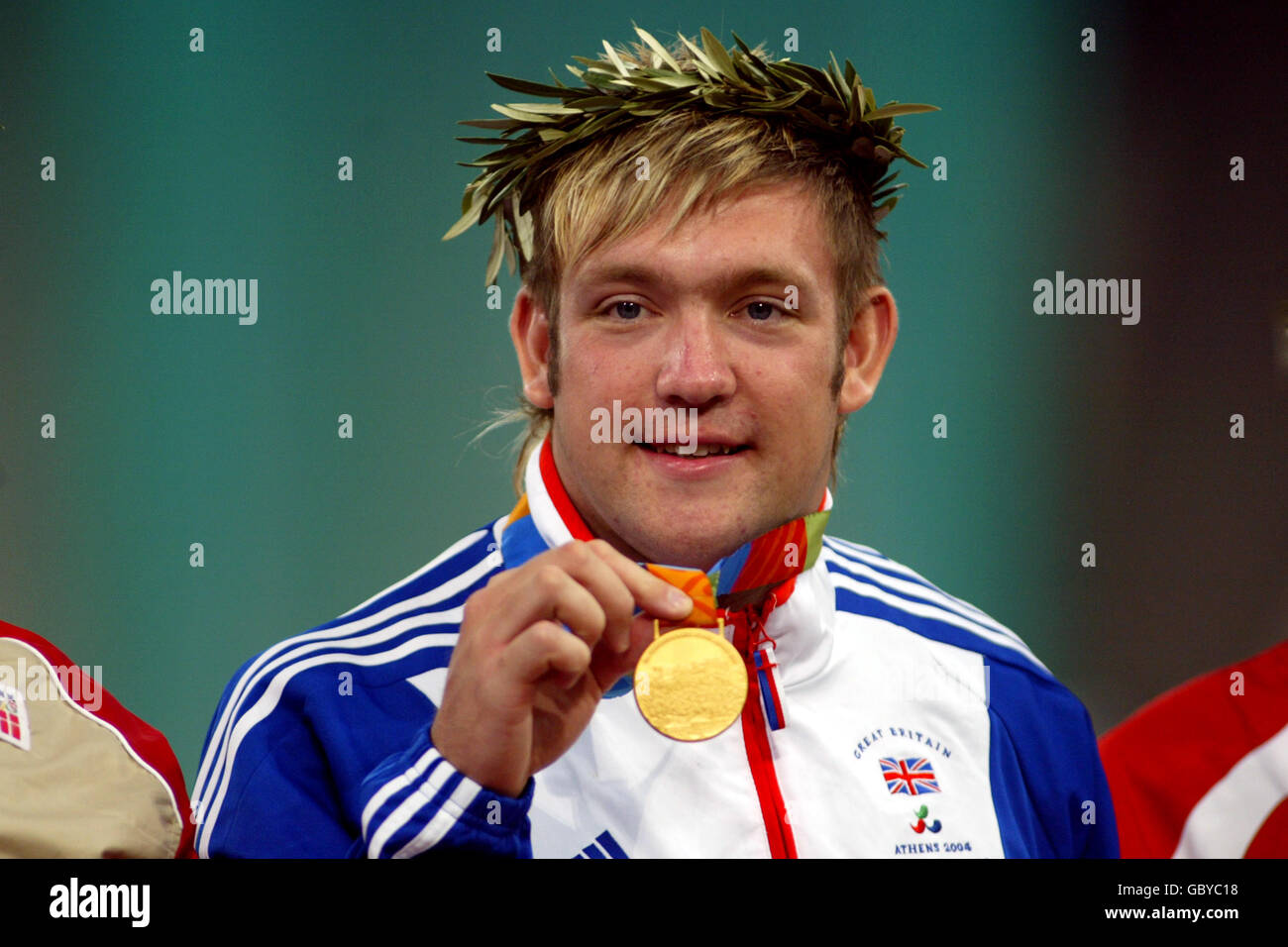 Athletics - Athens Paralympic Games - Men's F44/46 Discus - Final. Great  Britain's Dan Greaves celebrates winning the Gold Medal Stock Photo - Alamy