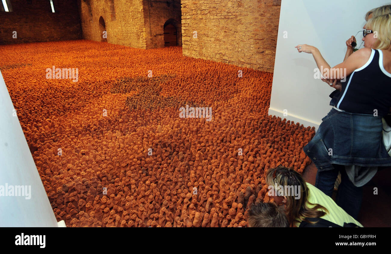 A section of 'Field for the British Isles' by Antony Gormley consisting of 40,000 miniature terracotta figures that fill the Spanish Barn at Torre Abbey, Torquay, Devon. Stock Photo