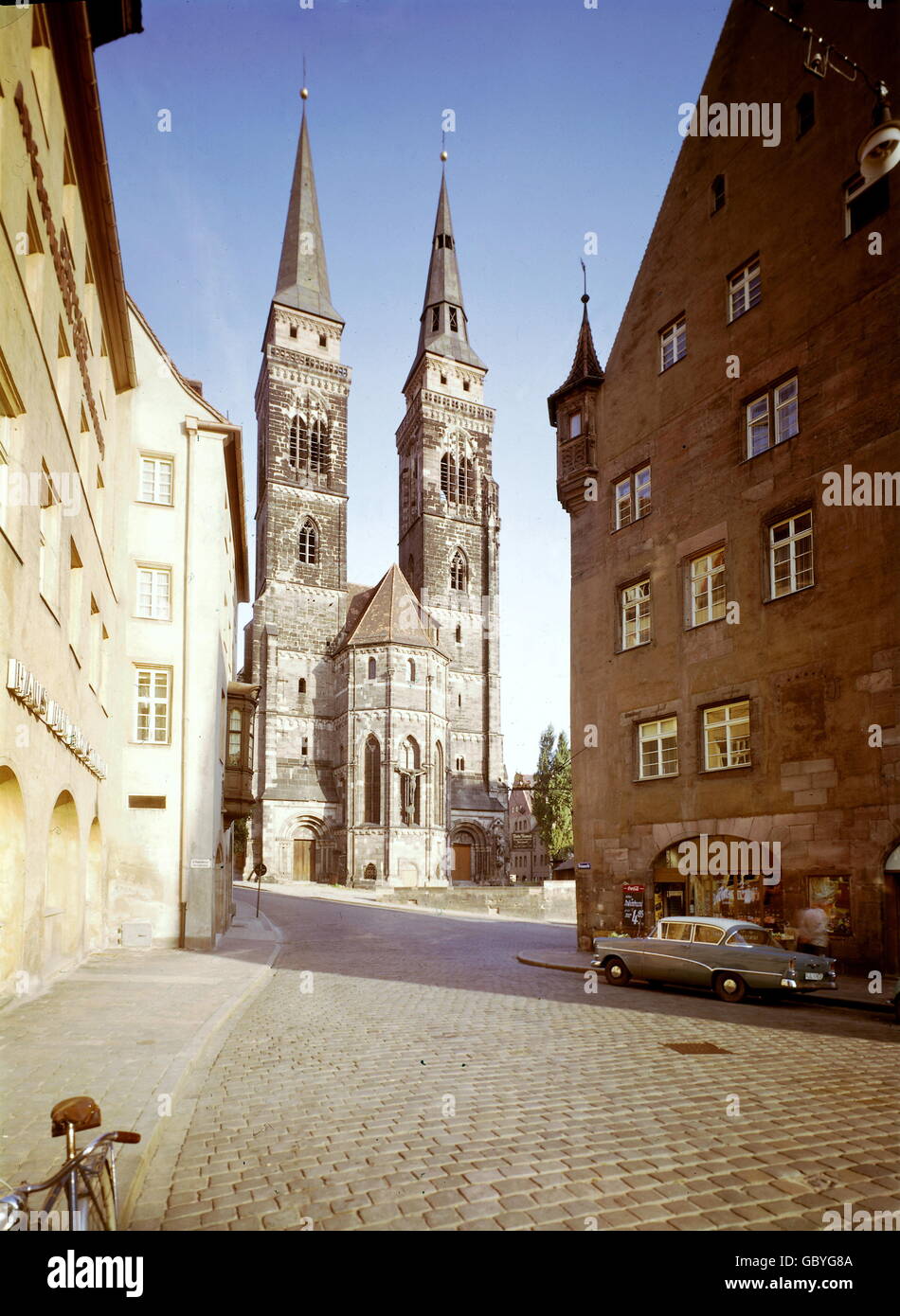geography / travel, Germany, Bavaria, Nuremberg, St. Sebaldus Church, west facade, built: 1237-1273, exterior view, circa 1950, 20th century, historic, historical, 1950s, 50s, Central Europe, west facades, towers, church, churches, sacral, sacred, building, buildings, architecture, car, Opel, old town, people, 1960s, Additional-Rights-Clearences-Not Available Stock Photo