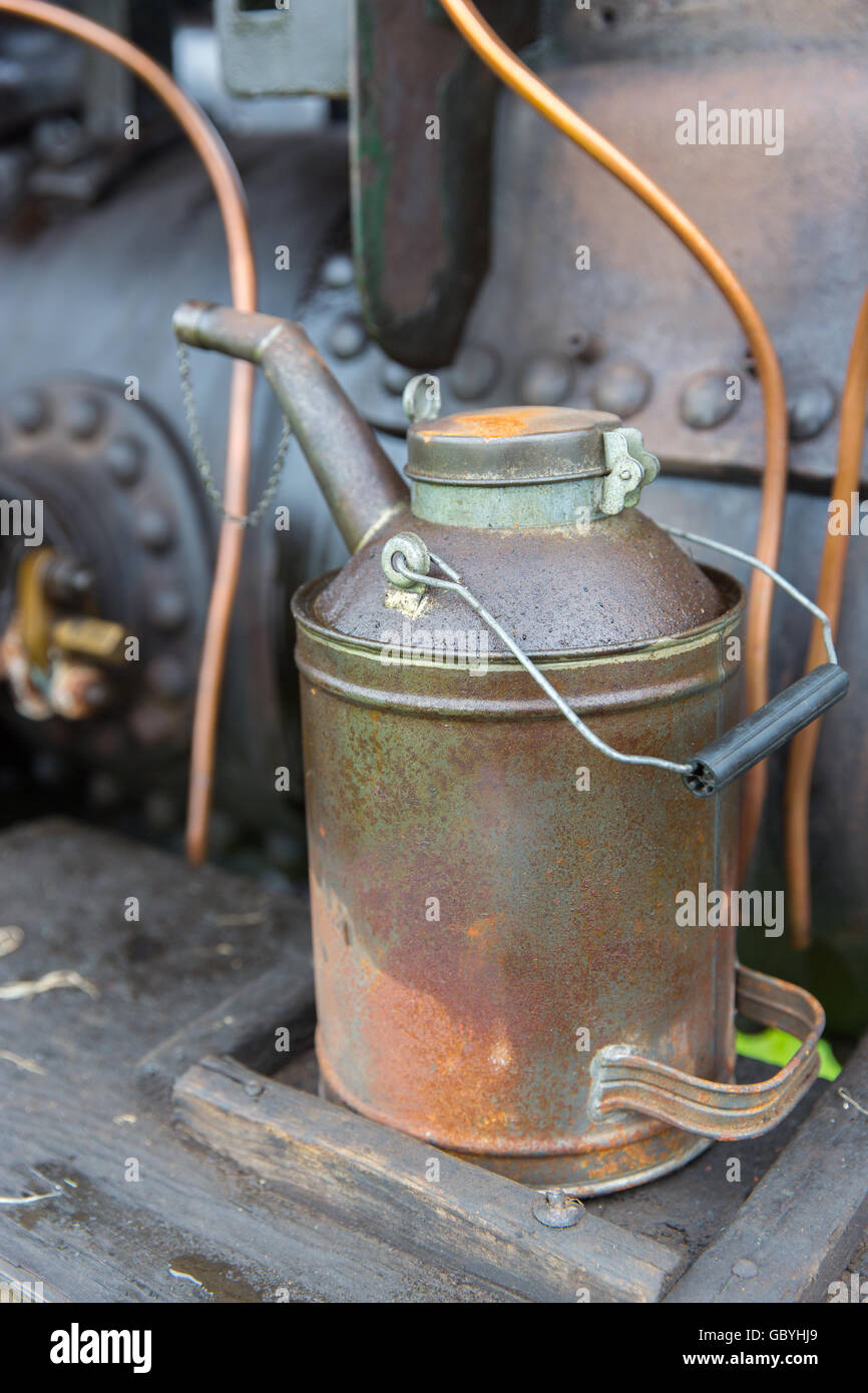 A watering can used to top up a steam engine Stock Photo Alamy