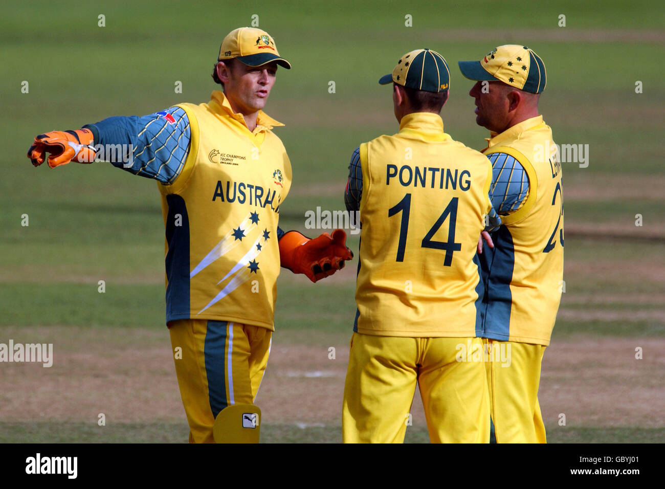 Australia's wicketkeeper Adam Gilchrist (l) discusses tatics with captain Ricky Ponting (c) and teamamte Darren Lehmann (r) Stock Photo