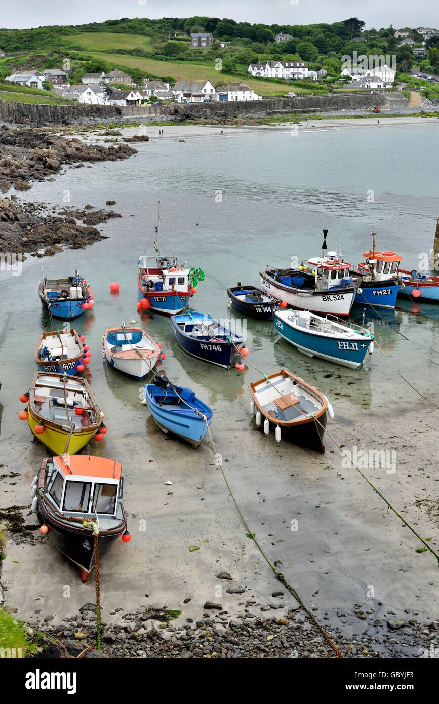 Fishing boats at low tide in Coverack Harbour Cornwall england UK Stock ...