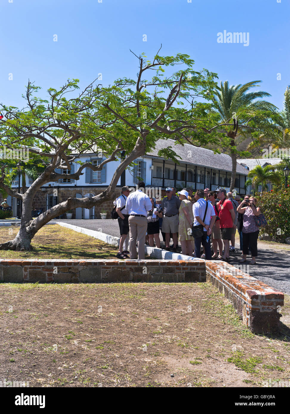 dh Nelsons Dockyard ANTIGUA CARIBBEAN Tour guide at English Harbour museum historical West Indies naval docks Stock Photo