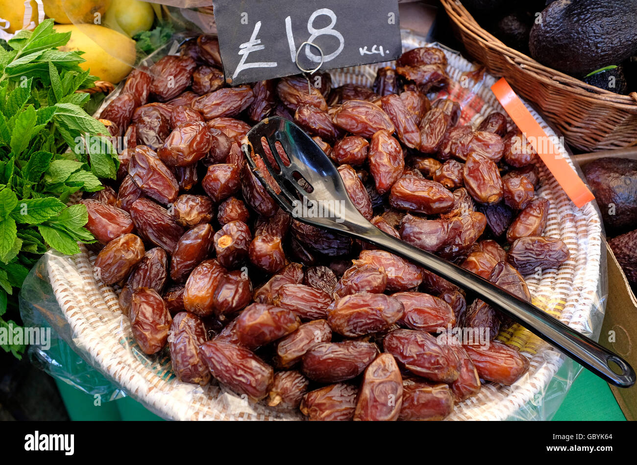 dates in wicker basket, borough market, london, england Stock Photo Alamy