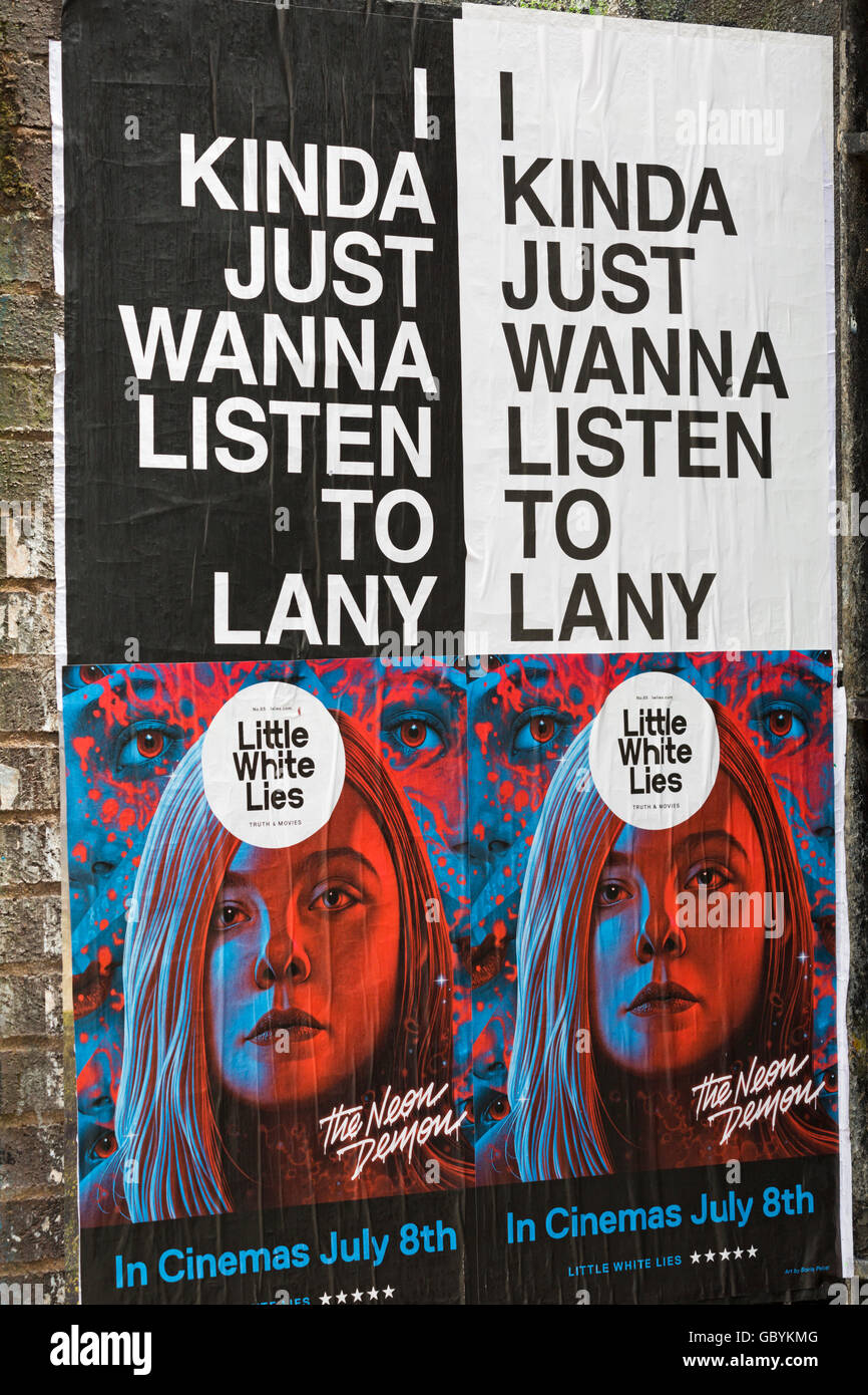 I kinda just wanna listen to Lany Little White Lies posters on wall at Shoreditch, London in July Stock Photo