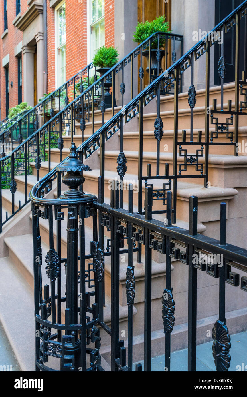 Wrought iron railing with geometric design along steps to house in Brooklyn Heights , New York Stock Photo
