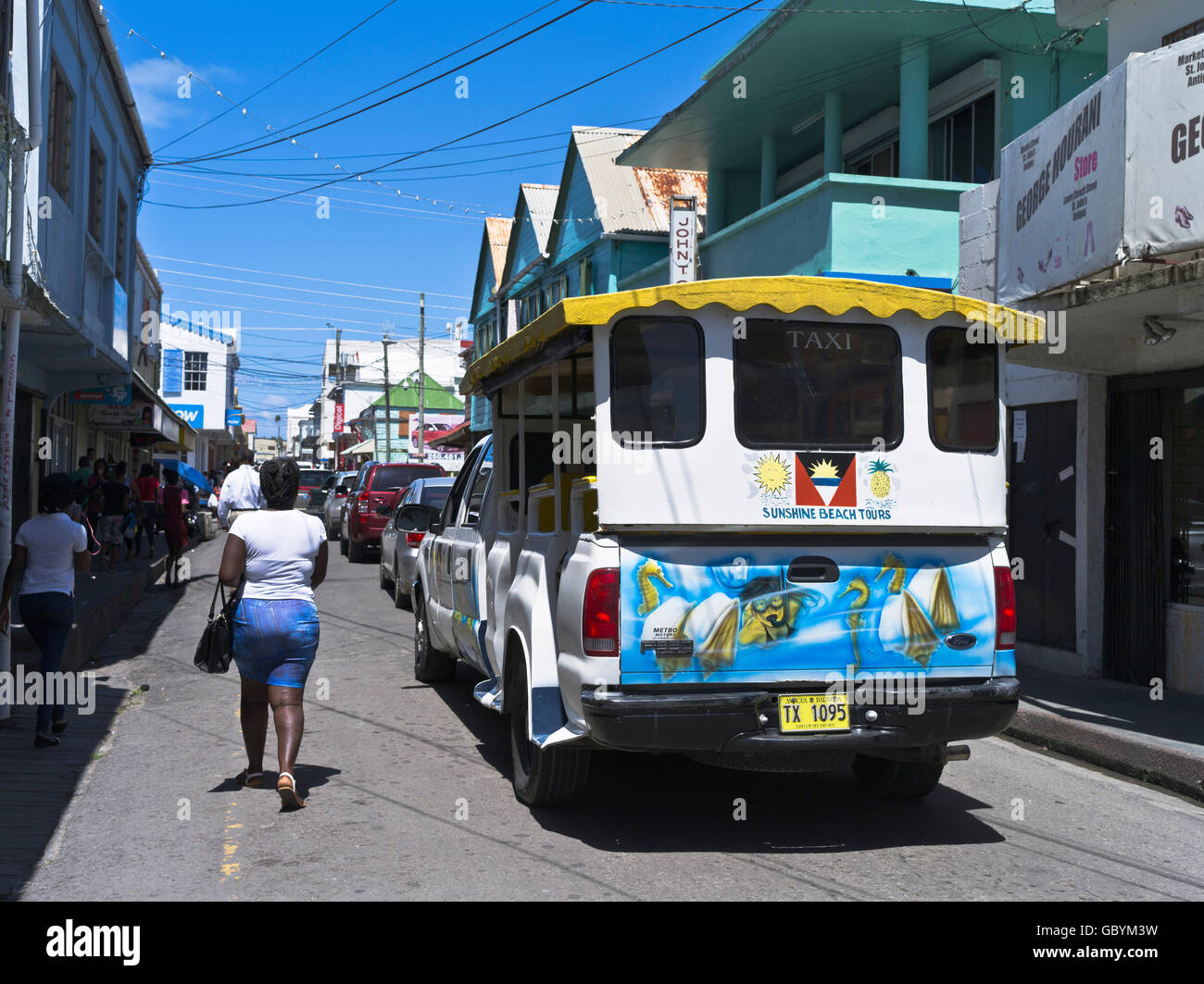 dh St Johns ANTIGUA CARIBBEAN Saint Johns street with tourist taxi