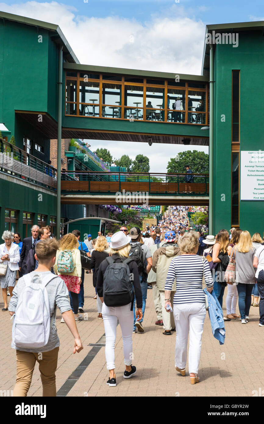 Visitors walk around the busy grounds during the Wimbledon 2016 Tennis Championships Stock Photo