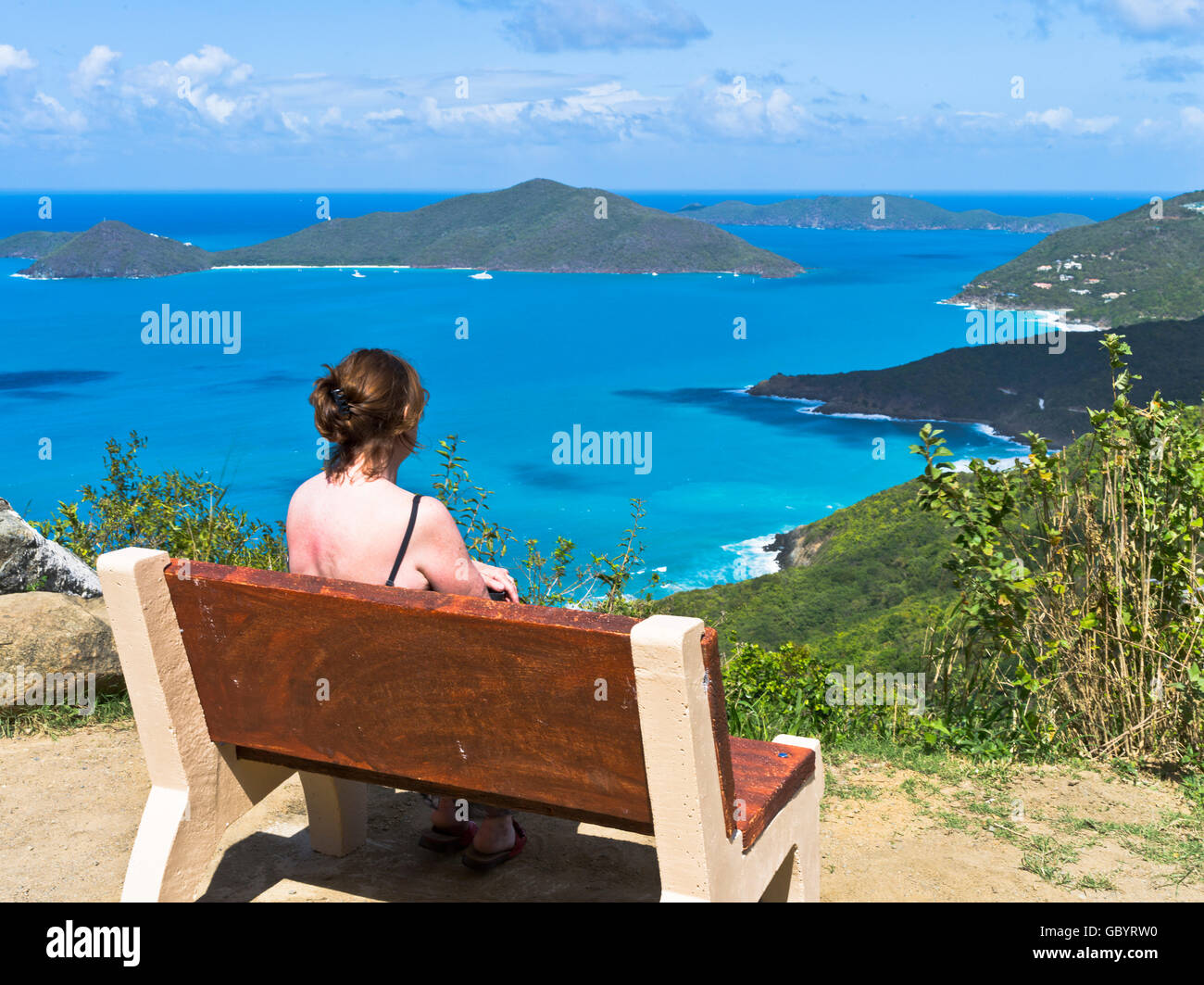 dh Ridge Road viewpoint TORTOLA CARIBBEAN Woman tourist View of Josiahs Bay Tortola island north coast bvi islands Stock Photo