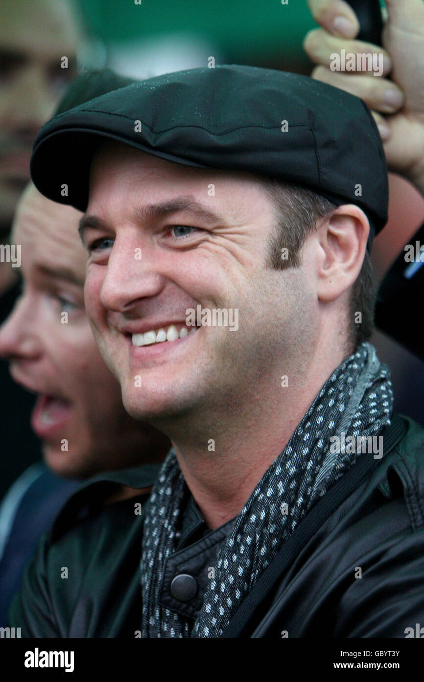 Boyzone's Mikey Graham prepares to hand over an award after a race at Sandown Park Stock Photo