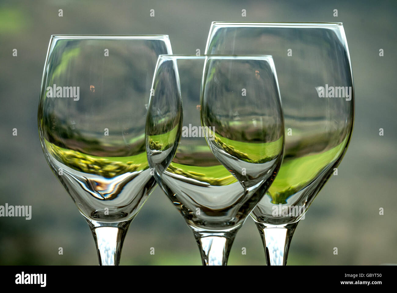 Wine glasses by the window of a West Country restaurant. Stock Photo