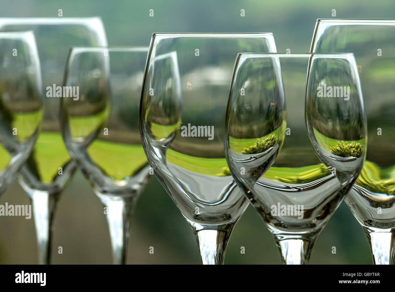 Wine glasses by the window of a West Country restaurant. Stock Photo