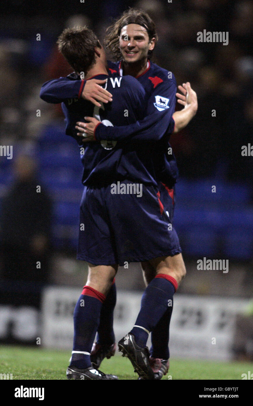 Portsmouth's Arjan De Zeeuw (l) celebrates with teammate Patrik Berger at the final whistle Stock Photo