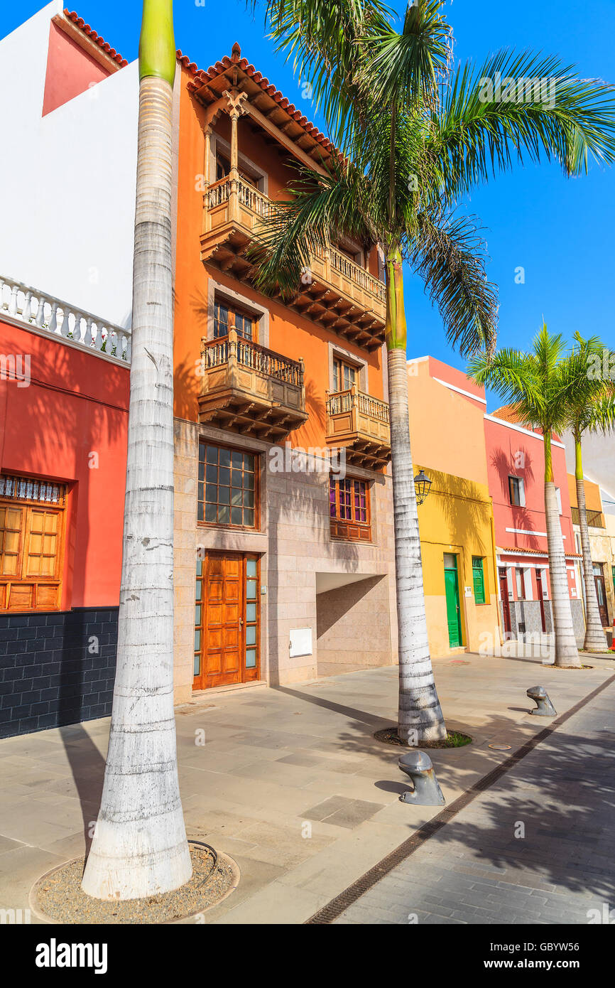 Colourful houses and palm trees on street in Puerto de la Cruz town, Tenerife, Canary Islands, Spain Stock Photo