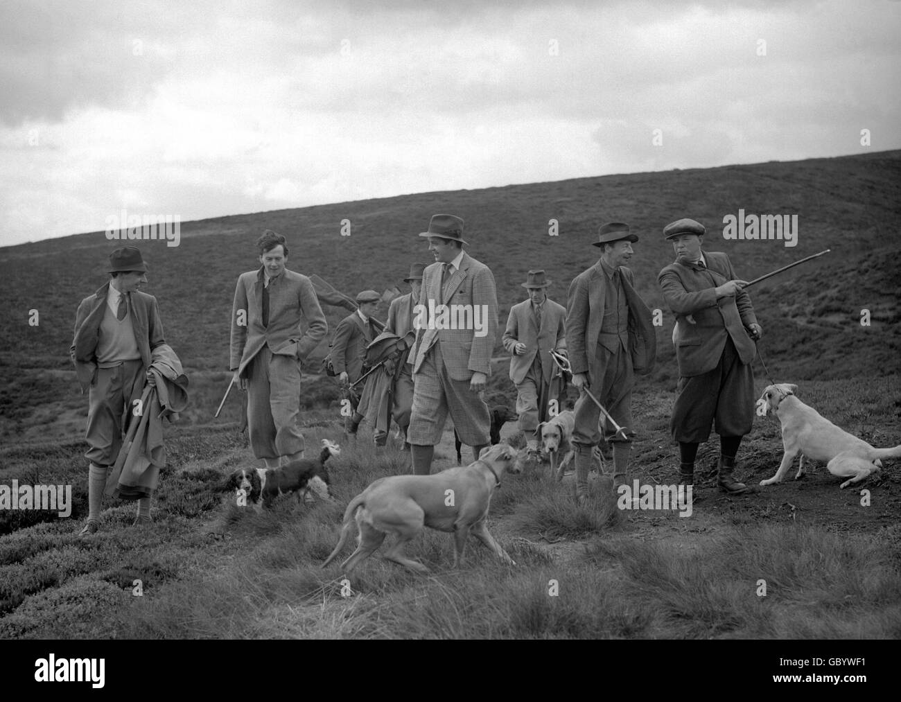 Left to right, The Hon. Major David Ormsby Gore, Lord Hartington, the Hon. Robert Cecil and the Duke of Devonshire, speaking to Mr Stitt, the Head Keeper, on the day the Duke of Devonshire opened grouse shooting season over the Bolton Abbey Moors, Yorkshire. Stock Photo