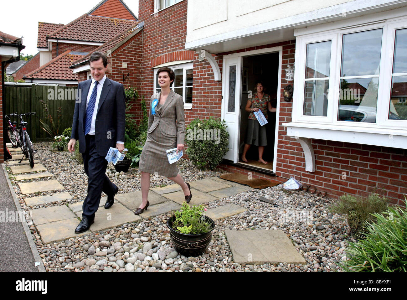 Conservative Party Parliamentary candidate Chloe Smith and shadow Chancellor George Osborne canvass on the streets of Taverham, Norwich, Norfolk, ahead of the North Norwich by-elections in the city. Stock Photo