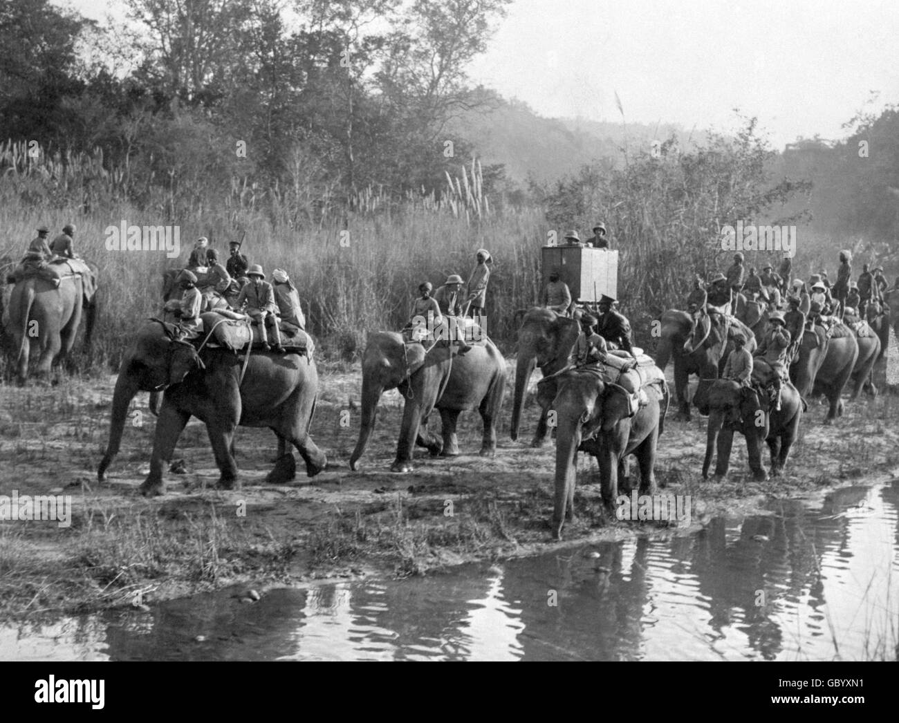 The Prince of Wales, on leading elephant, left, on the way to a tiger shoot in Nepal, during his Indian tour of 1921. Stock Photo