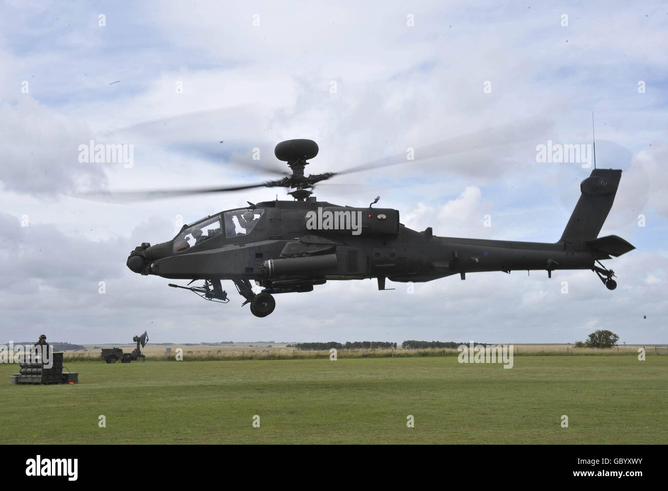 An Army Air Corps Apache Attack helicopter takes off during 11 Light Brigade's training exercise on Salisbury Plain as they prepare to deploy to Afghanistan. Stock Photo