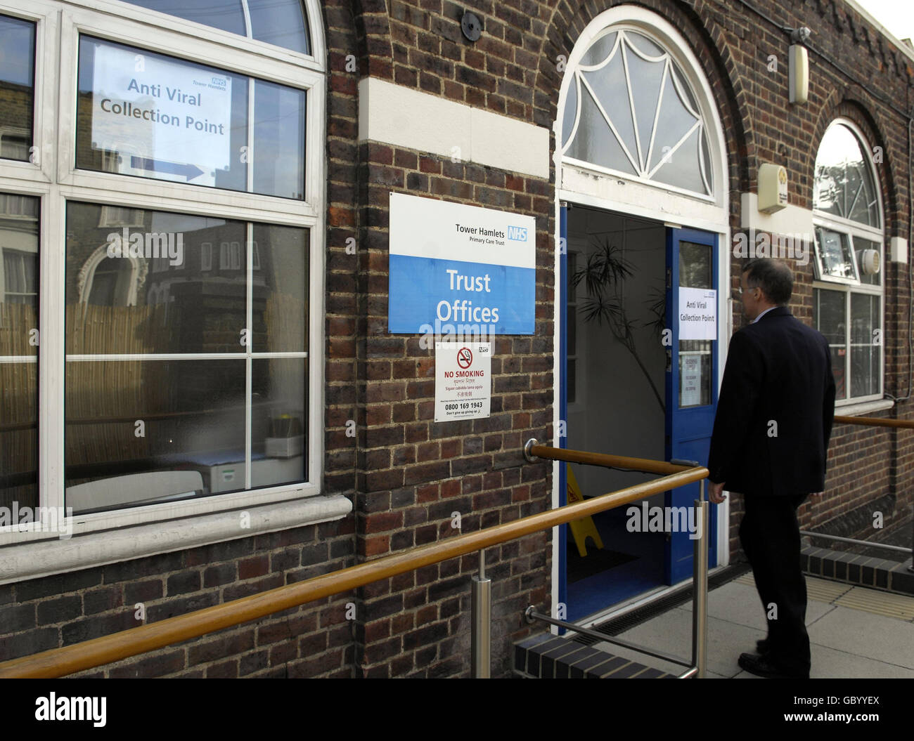 A man arrives at Mile End Hospital's antiviral collection point
