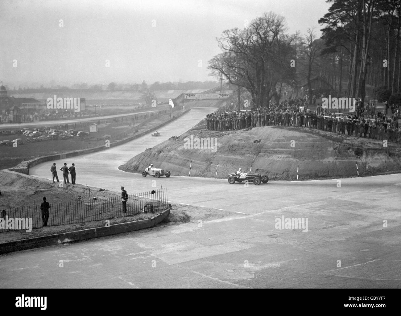 Motor Racing - Campbell Trophy Race - Brooklands. Cars coming onto the old track from Members Hill Turn during the Campbell Trophy Race at Brooklands. Stock Photo