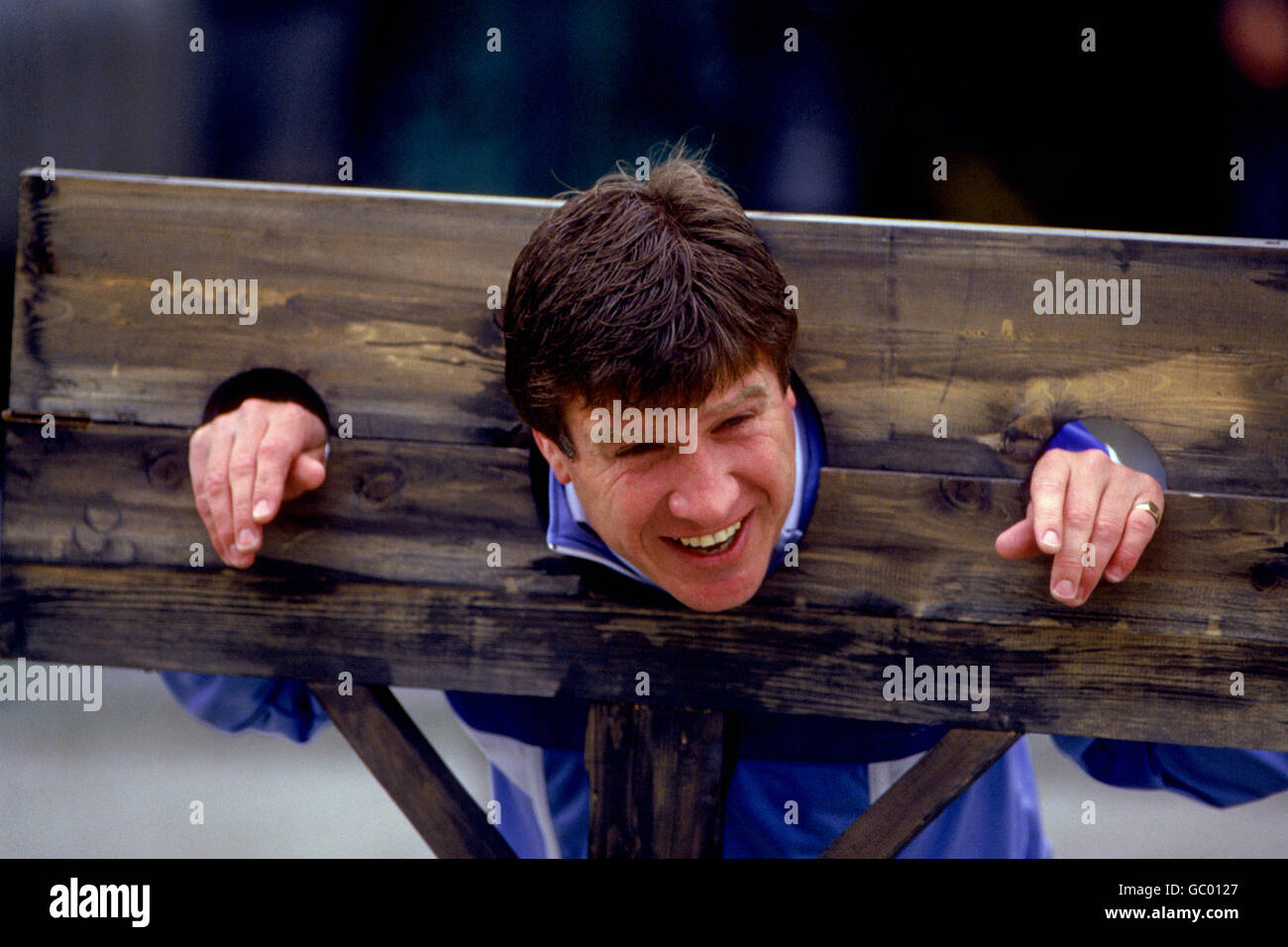Emlyn Hughes poses in the stocks to publicize the Grand Knockout Tournament Stock Photo