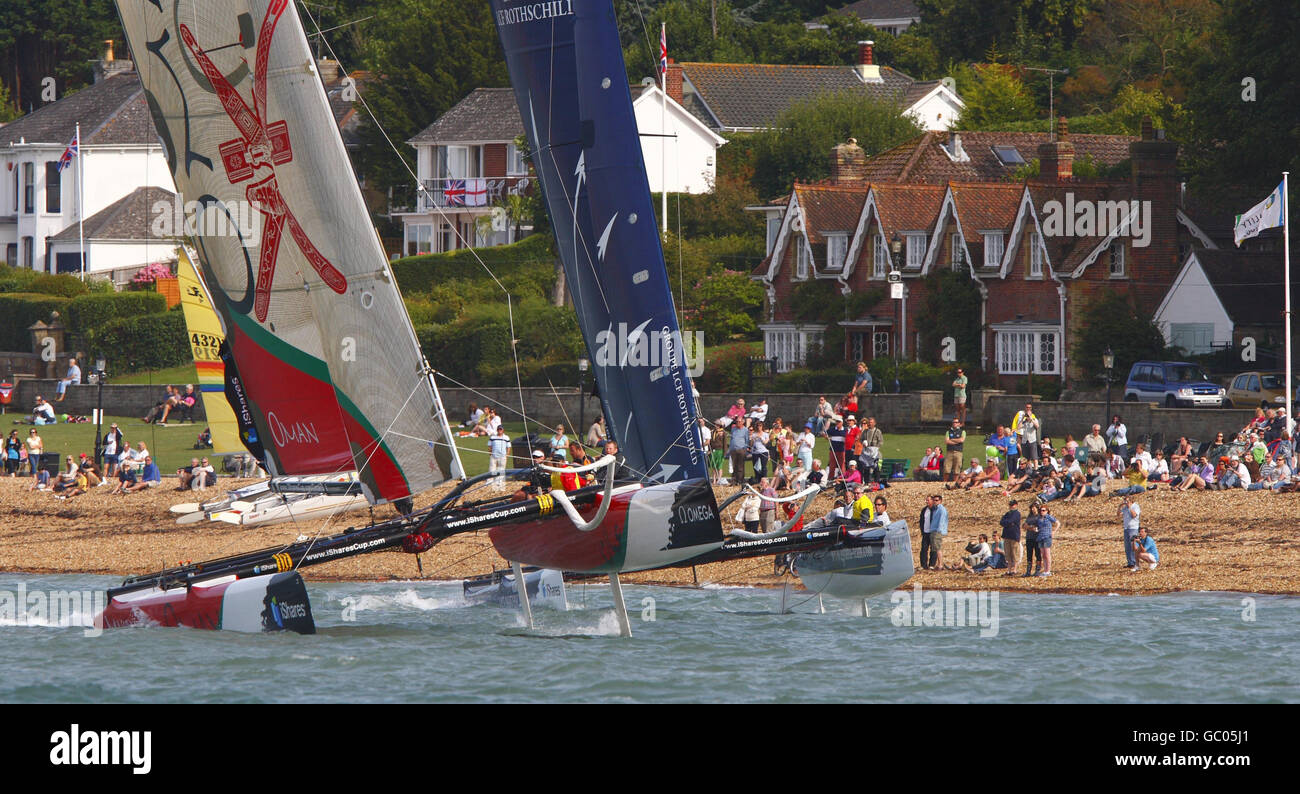 Masirah Oman Sail (left) and Gitana Extreme race from the beach in the iShares Cup during Cowes Week on the Isle of Wight. Stock Photo