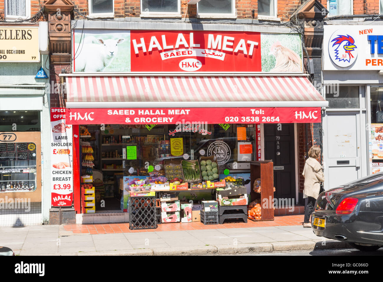 Store front view of Halal grocery and meat shop in London England with produce displayed on the