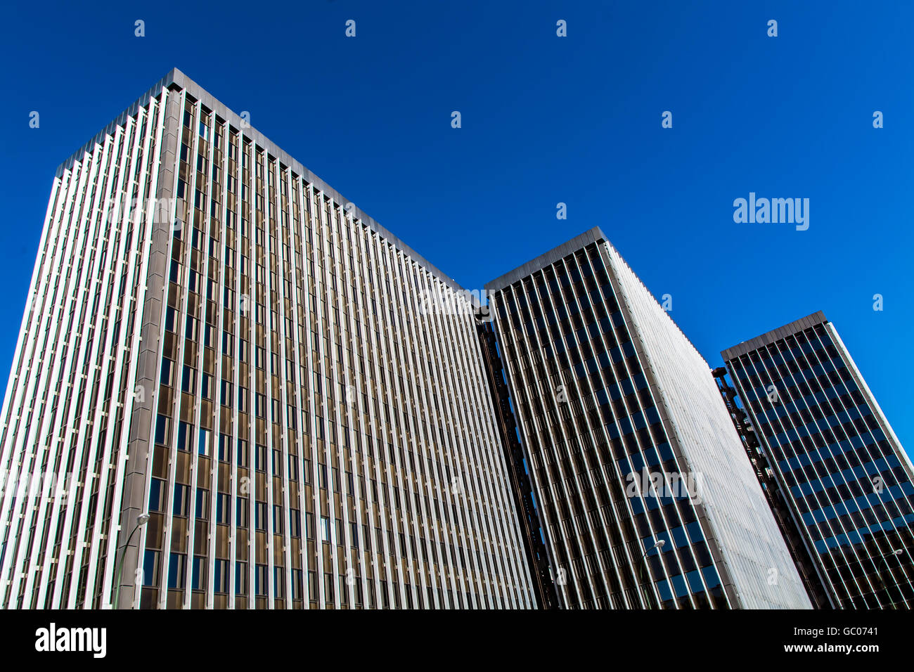 Low Angle View of Office Building Against Clear Blue Sky Stock Photo ...