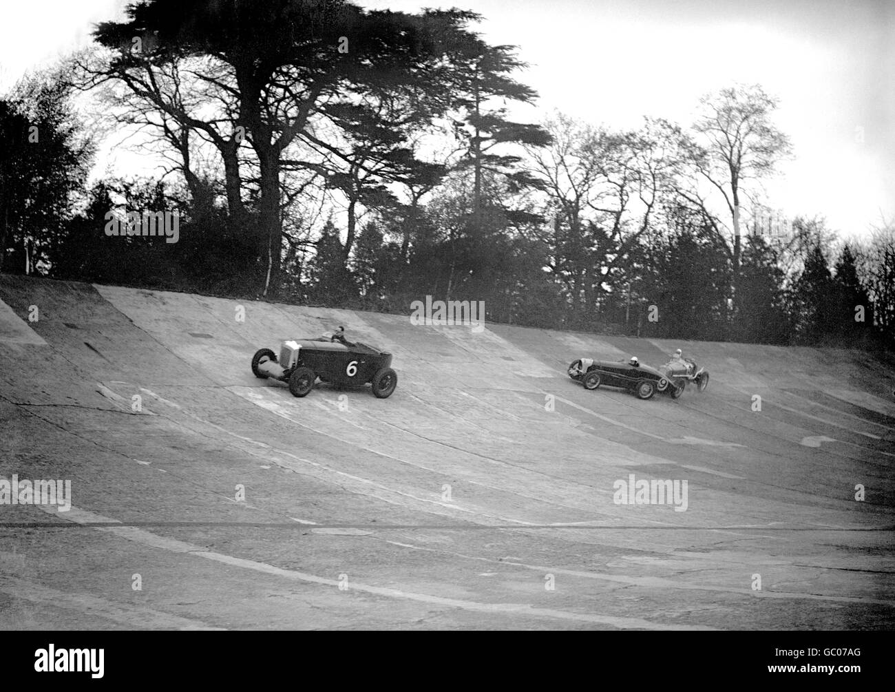 H.T.H Clayton and 'Ginger' Hamilton's cars touch on the banking at Brooklands. Stock Photo