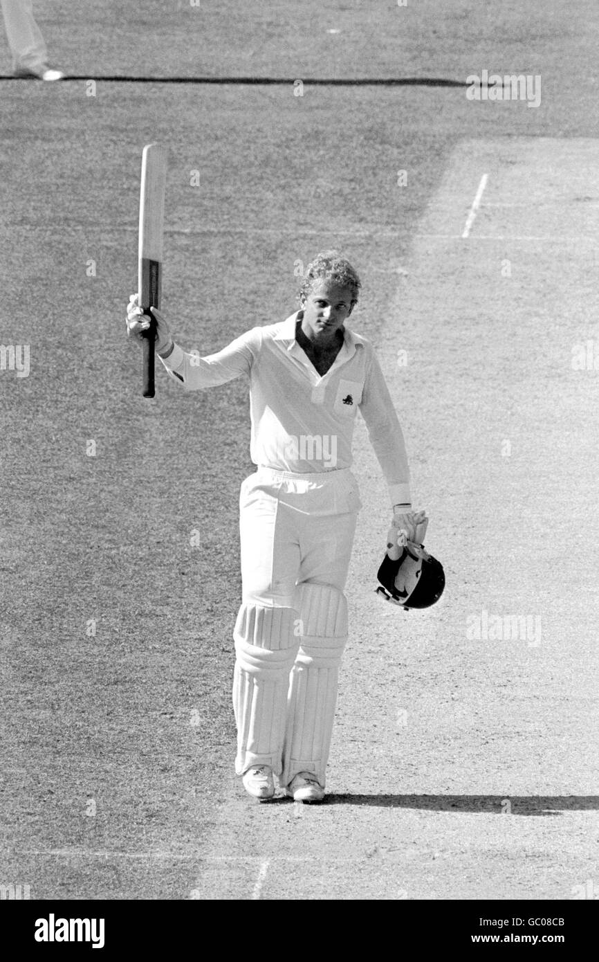 England's David Gower raises his bat to acknowledge the cheers after he completed his century Stock Photo