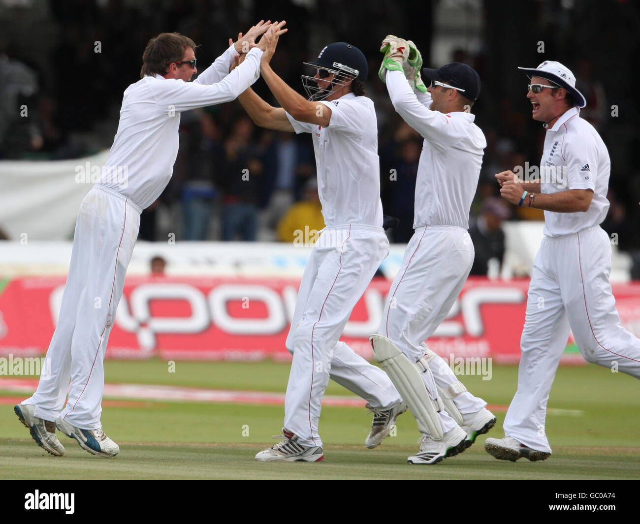 England bowler Graeme Swann (left) celebrates after taking key wicket of Australia batsman Michael Clarke with Alastair Cook, Matt Prior and Andrew Stauss (right) during the fifth day of the second npower Test match at Lord's, London. Stock Photo