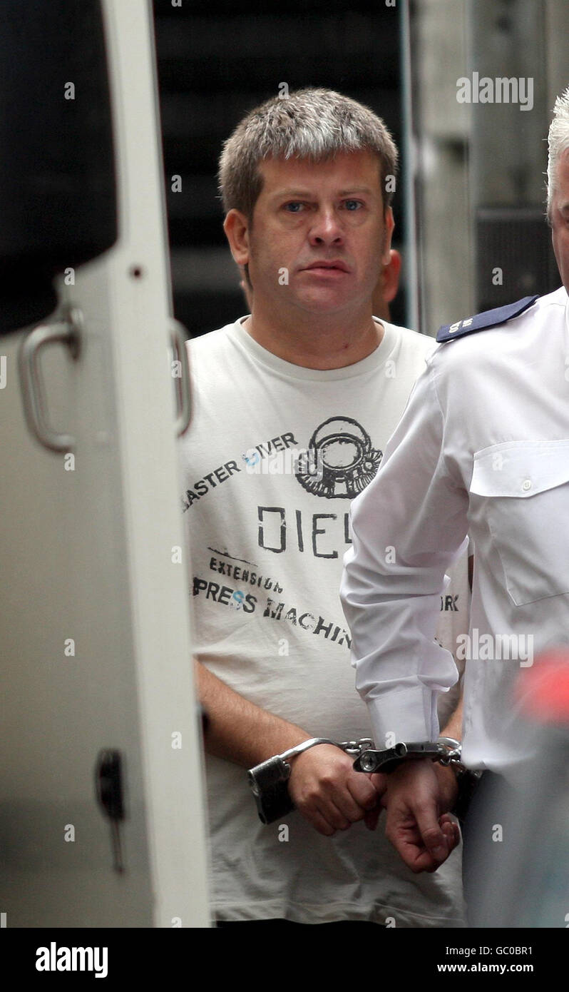 Brian Patrick Shivers, from Maghera, County Londonderry, is led from Ballymena Magistrates court in Co Antrim. Shivers, 44, is accused of murdering two British soldiers outside the Massereene base in Antrim. left his DNA on matchsticks found in a partially burnt out getaway car, a court heard today. Stock Photo