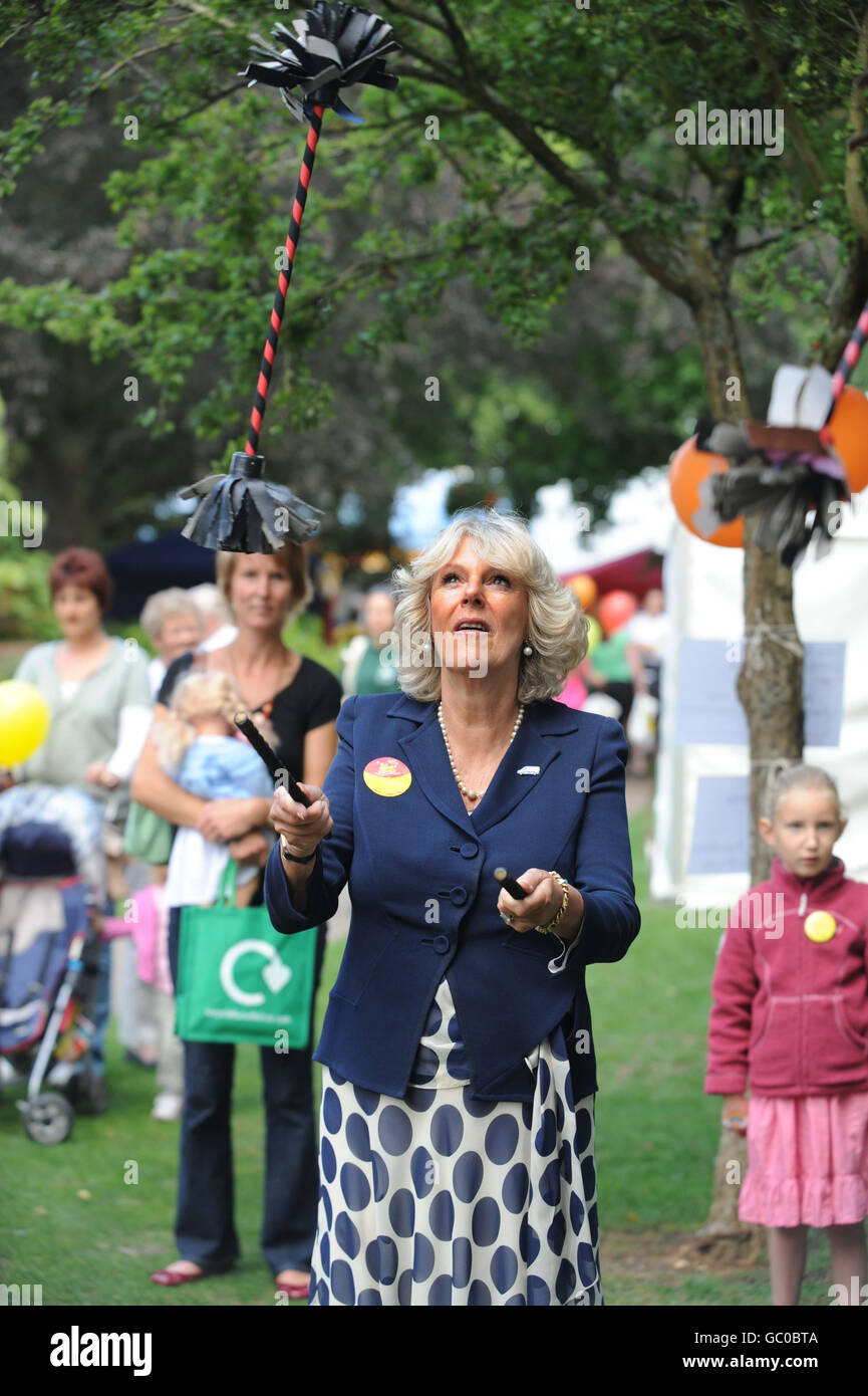 The Duchess of Cornwall at the West Wilts Show. The Duchess of Cornwall tries juggling sticks at the West Wilts Show, at Trowbridge Park, Wiltshire. Stock Photo