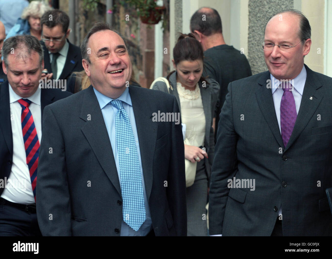 First Minister Alex Salmond (left) and Finance Secretary John Swinney walk up Melrose High street in the Scottish Borders after a Scottish cabinet meeting at Melrose Rugby Club the latest venue on its summer tour of Scotland. Stock Photo
