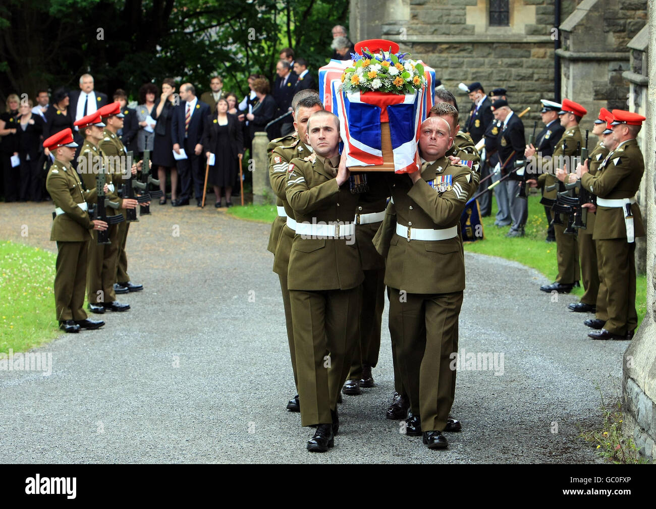 The coffin of Lance Corporal David Dennis is carried from All Saints