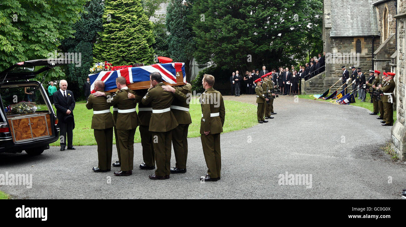 The coffin of Lance Corporal David Dennis is carried from All Saints