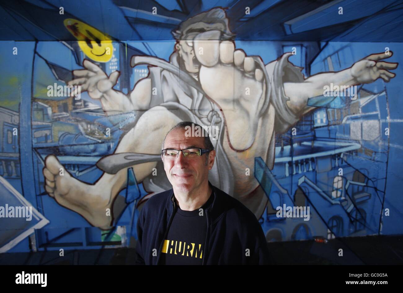 Dave Gibbons, the original illustrator of The Watchmen comics in front of artwork by graffiti artist Chu which depicts a scene from Watchmen, now available on DVD and Blu-ray, at the South Bank Skate Park in London. PRESS ASSOCIATION Photo. Picture date: Tuesday July 28, 2009. The visually spectacular film, directed by Zack Snyder, is based on the 1980s comic book series of the same name created by Alan Moore and illustrated by Dave Gibbons. Photo credit should read: David Parry/PA Wire Stock Photo