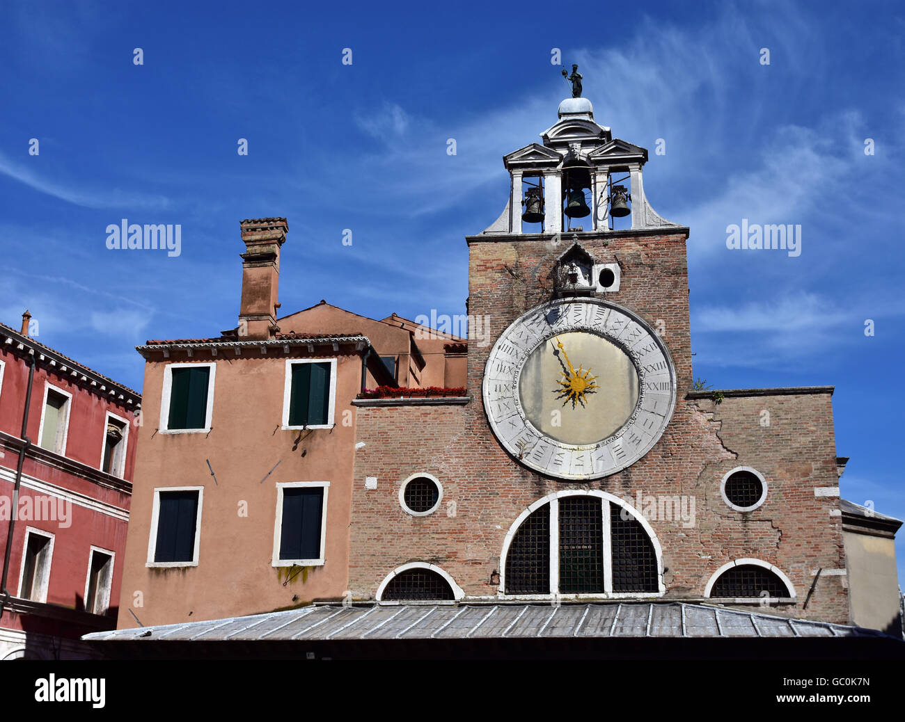 San Giacomo di Rialto ancient medieval clock and bell tower, in the market square, the oldest church in Venice Stock Photo