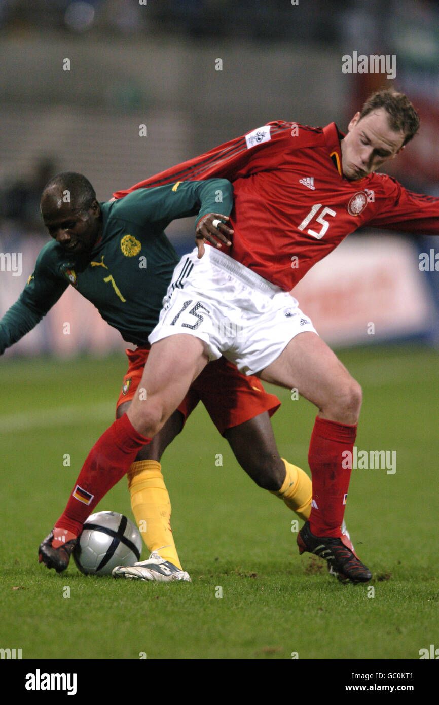 Germany's Fabian Ernst (r) and Cameroon's Guy Armand Feutchine battle